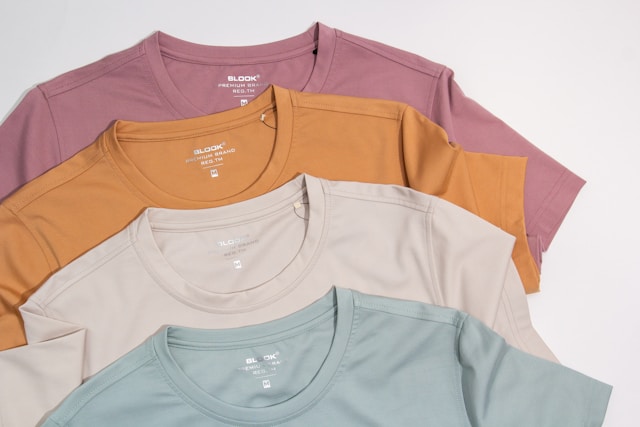 Pastel Cotton T-Shirts for Men & Women – Minimal Casual Wear Collection Stack of pastel colored cotton t-shirts in soft shades for casual everyday wear